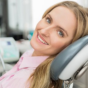 Smiling woman in dental chart