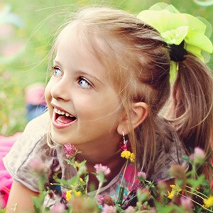 Smiling child outdoors after children's dentistry visit
