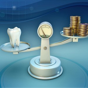 Coins and tooth on balance scale