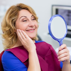 Patient in Haverhill smiling after receiving new custom dentures