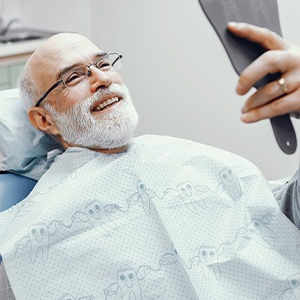 Patient trying on a wax denture model for a fit check