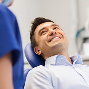 Smiling man in dental chair