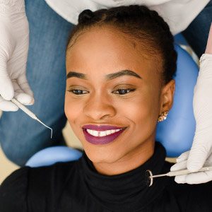 Woman receiving dental exam