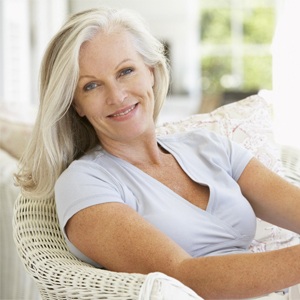 older woman with all on four dental implants smiling