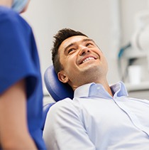 Smiling man in dental chair