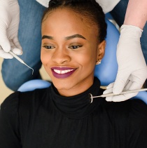 Woman receiving dental exam