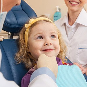 Little girl receiving dental exam