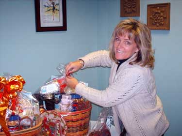 Team member putting together a gift basket