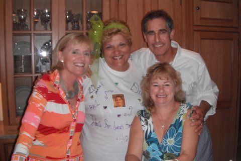 Lisa and team members smiling together