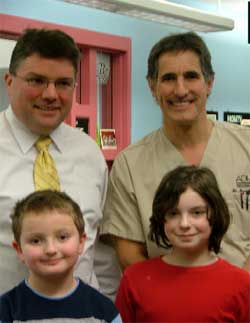 Dentists and kids smiling together
