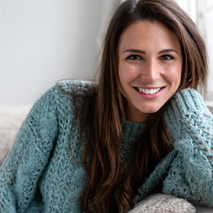 a woman smiling after visiting her cosmetic dentist in Haverhill