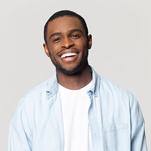 Smiling man with dental crowns in Haverhill