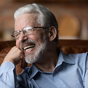 Man smiling on a couch