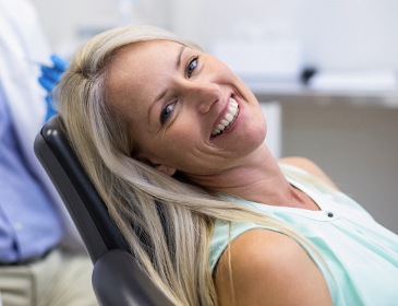 Relaxed woman smiling in dental chair