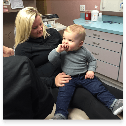 Patient with her child at dental appointment