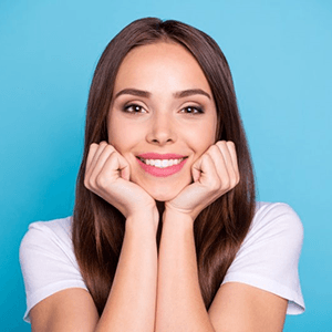 a woman smiling after getting a smile makeover in Haverhill