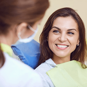 a patient smiling after undergoing a smile makeover