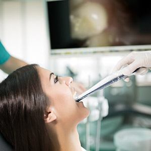 Dentist and patient looking at digital images