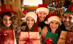 Friends smiling with holiday decorations around