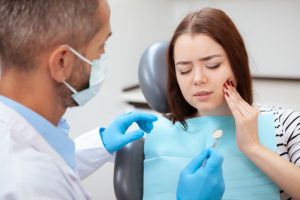 a woman being treated for a dental emergency